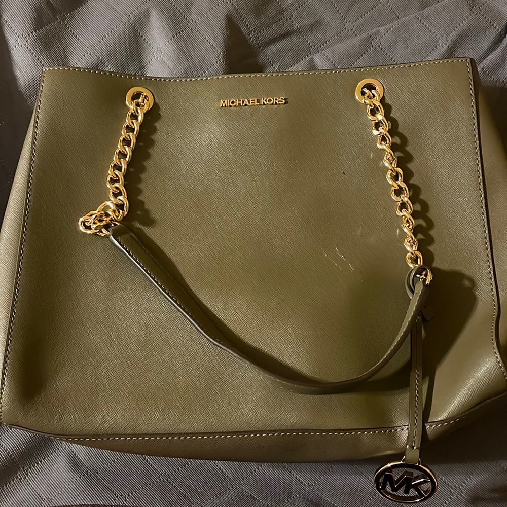 Authentic Michael Kors handbag. See closet for matching wallet.